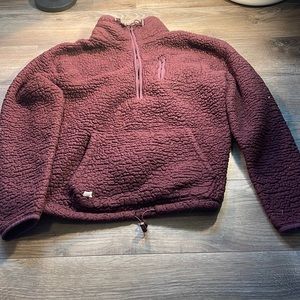 This is a purple fluffy sweater really warm